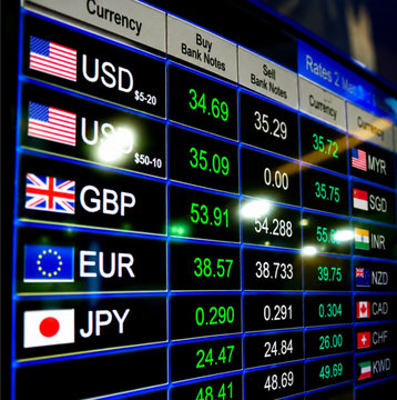 A digital currency exchange board displays real-time forex rates for USD, GBP, EUR, and JPY alongside other currencies, illustrating the global FX market that Binance is now tapping into with its new 24/7 FX perpetual futures contracts starting with the USDBRLUSDT pair.