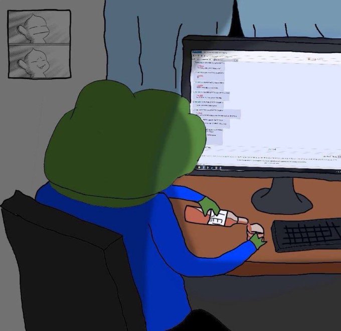 A cartoon illustration of a green frog-like character wearing a blue shirt sitting at a desk, appearing to be using a small object near a computer showing code.