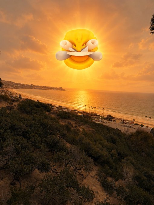Sunset view over a coastal beach with a large angry emoji sun emoji superimposed in the sky above the ocean.