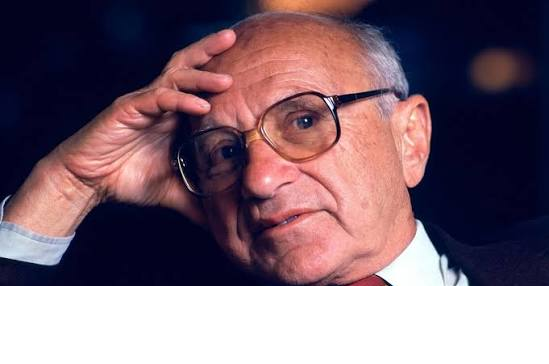An elderly man with glasses resting his hand on his forehead in a thoughtful pose.