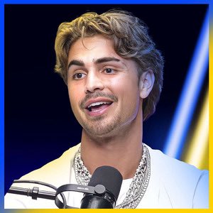 The image shows a young man with blonde curly hair and a light mustache, wearing a white jacket and silver chain, speaking into a microphone during what appears to be a podcast or interview setting.

**Connection to the post:** The post criticizes crypto influencers who exploit their audiences as "exit liquidity," and the image appears to depict one such figure—a podcast host or social media personality who uses such platforms to promote crypto projects for personal gain.