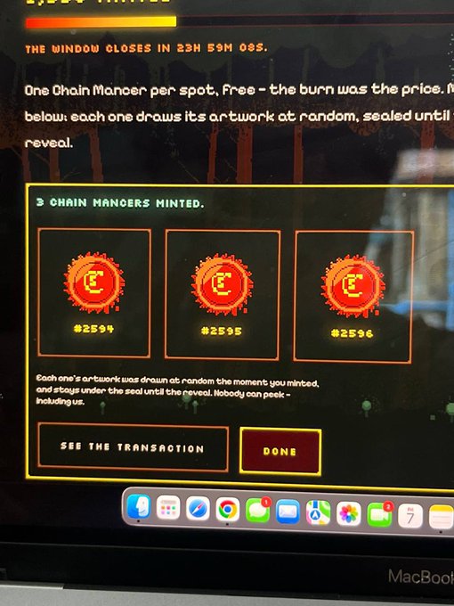 A photograph of a MacBook screen displaying the successful minting of 3 Chain Mancers NFTs (#2594, #2595, #2596) on a blockchain marketplace.