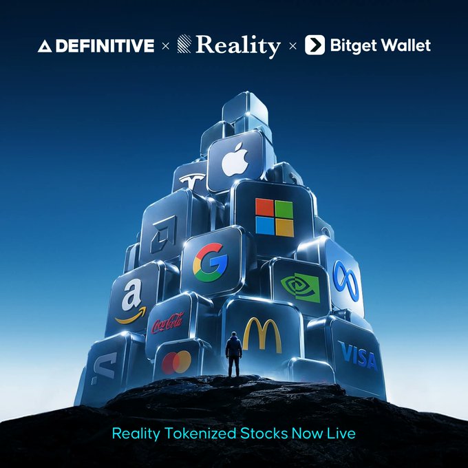 The image promotes "Reality Tokenized Stocks Now Live" through a partnership between Definitive, Reality, and Bitget Wallet, depicted by a small figure standing before a towering pyramid of glowing cubes featuring major corporate logos including Apple, Microsoft, Google, Tesla, Coca-Cola, McDonald's, Mastercard, Visa, Amazon, Meta, and NVIDIA. The visual symbolizes how the collaboration brings tokenized real-world assets (rTokens) backed 1:1 by real shares of these top companies to traders using advanced order types like DCA, Limit, Stop Loss, and Take Profit.