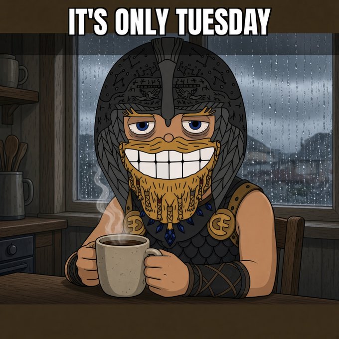 A cartoon Viking with a wide grin sips a hot mug in front of a rainy window beneath the bold text "IT'S ONLY TUESDAY," capturing the midweek endurance humor echoed in the post about getting through Tuesday before the weekend arrives.