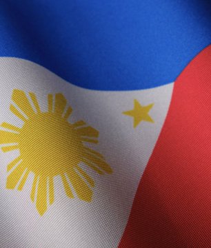 The image features a close-up view of a flag with the Philippines written across it. The flag has a blue background, red border, and yellow sun design at its center. The text "The door is open for RWA tokenization in the Philippines" is also present on the image. This suggests that there might be an advertisement or promotional material related to real-world assets, such as real estate or cryptocurrency, being tokenized by RWA (Risk Weighted Assets).