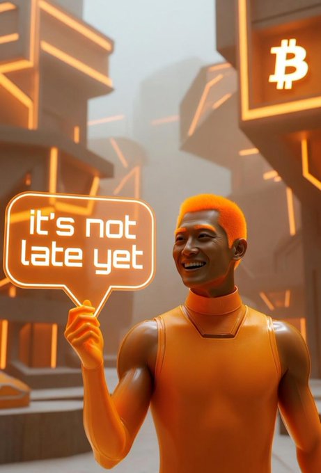 A 3D-rendered orange figure in a futuristic city setting holds a speech bubble reading 'it's not late yet' with a Bitcoin logo displayed on a building in the background.