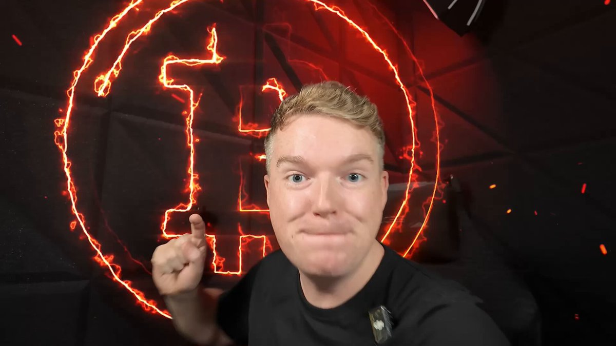 The image features a man with blonde hair wearing a black shirt, standing against a dark background that includes a red circle and some sparks. The man appears to be making a gesture or giving a thumbs up sign. The caption of the image reads "BITCOIN HEATMAP TRAP!! WATCH ASAP!! MICROSTRATEGY IS IN DANGER!!!". This message seems to be related to Bitcoin, as it is often used in discussions about cryptocurrency and blockchain technology.