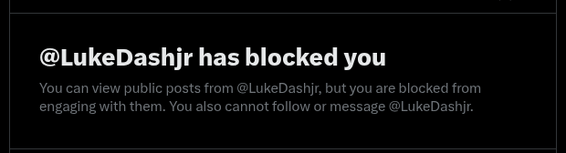 A Twitter/X notification message stating '@LukeDashjr has blocked you', explaining that public posts can be viewed but engagement, follows, and messages are restricted.