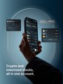 A promotional graphic showing a hand holding a smartphone with floating screens, displaying the text 'Crypto and forex based leveraged tokens, all in one account.'