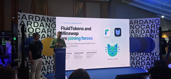 A presentation stage at a Cardano event showing a slide titled 'FluidTokens and Minswap are joining forces,' with a man speaking at a podium.