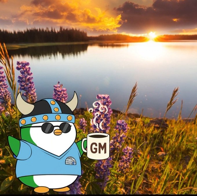 A cartoon penguin character wearing a Viking horned helmet, sunglasses, and a blue shirt, holding a coffee mug labeled "GM" against a sunset lake backdrop with purple flowers.