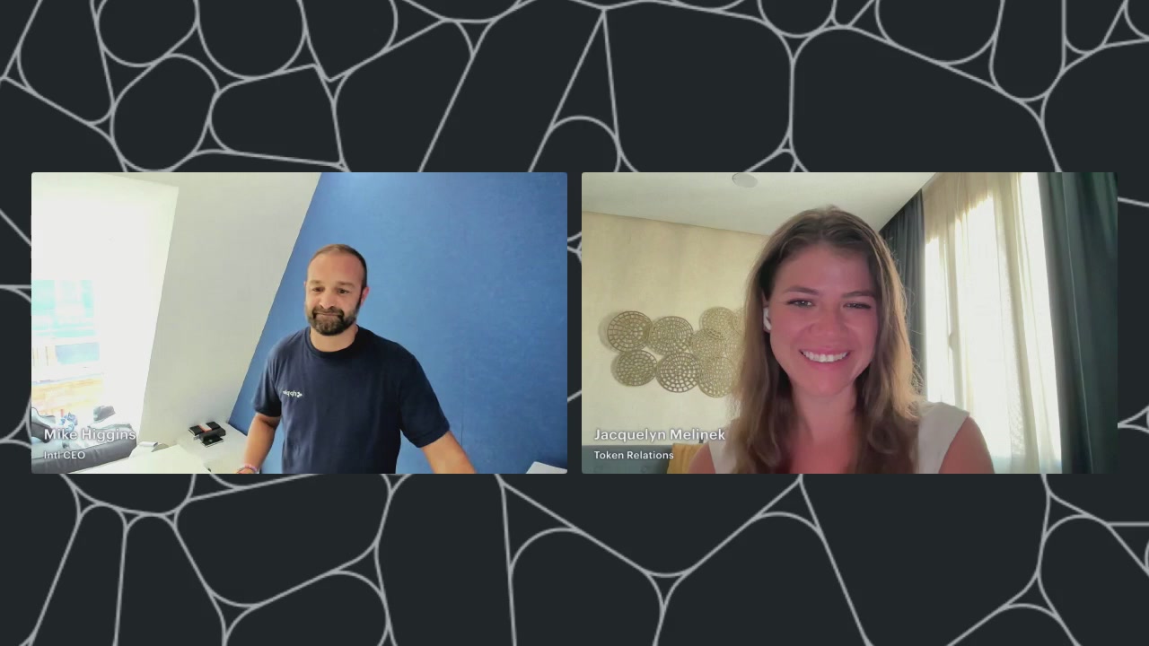 The image shows a man and woman having a video call, with both individuals smiling at the camera. The background features a black and white patterned design that includes circles and lines. The text overlay of the image reads "Interesting interview with Mike from Ripple Prime today. You can manage collateral 24/7 outside of banking hours by using stablecoins like RLUSD on XRP." This message is related to the content in the image, as it suggests a connection between the man's name (Mike) and Ripple Prime, which is likely an online financial services platform that allows users to invest in cryptocurrencies.