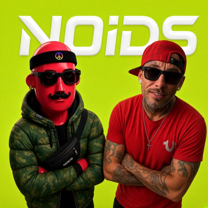 A promotional image featuring the text 'NOIDS' at the top, showing a red mascot character wearing a camo jacket alongside a man in a red shirt, backwards cap, and sunglasses against a bright green background.