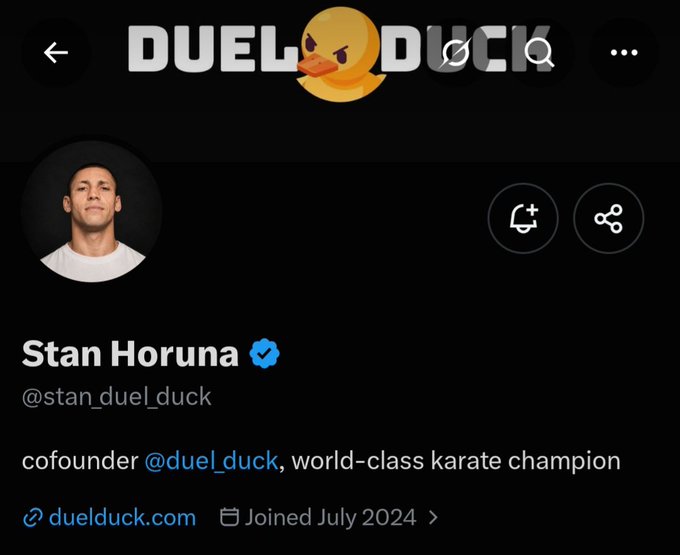 The image shows a Twitter/X profile page for Stan Horuna (@stan_duel_duck), displayed beneath the "DUEL DUCK" logo featuring an angry duck emoji. His bio identifies him as "cofounder @duel_duck, world-class karate champion," with a link to duelduck.com and a join date of July 2024.

The image directly illustrates the post by introducing the co-founder being highlighted, showing his verified profile, karate champion credentials, and connection to the @duel_duck prediction platform mentioned in the caption.