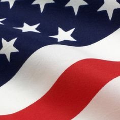 An American flag waves, symbolizing the US government's recent large-scale crypto transfers that have reportedly added pressure to the market.