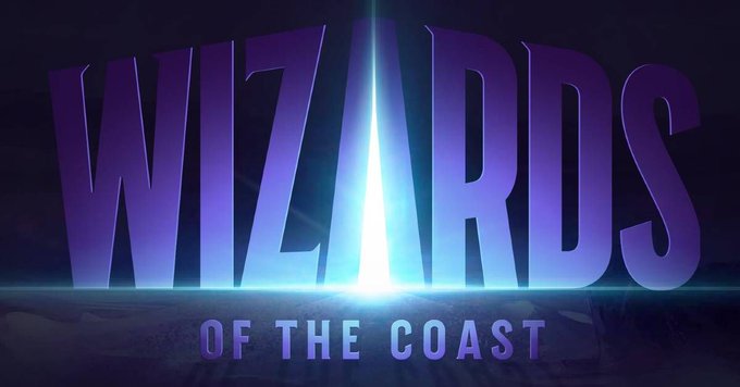 The image displays the "WIZARDS OF THE COAST" logo in bold purple lettering with a bright blue light radiating from the center, directly referencing the company mentioned in the post about their president's departure.