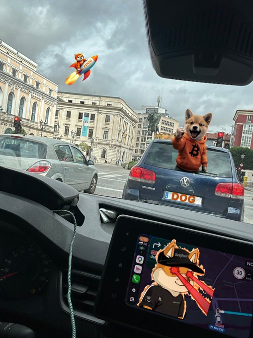 A surreal photo taken from inside a car showing a Shiba Inu dog wearing an orange hoodie emerging from a Volkswagen trunk with a 'DOG' license plate, while another dog rides a rocket in the cloudy sky and a graphic appears on the dashboard screen.