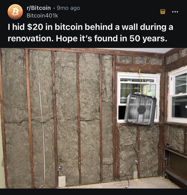 A Reddit post from r/Bitcoin titled 'Bitcoin401k' with text 'I hid $20 in bitcoin behind a wall during a renovation. Hope it's found in 50 years.', showing a photo of an unfinished wall with insulation and a fan hanging from a window.