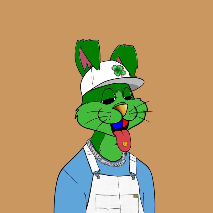 A cartoon illustration of a green cat wearing a white cap with a clover, a blue shirt, white overalls, and a chain necklace, with its tongue sticking out against an orange background.