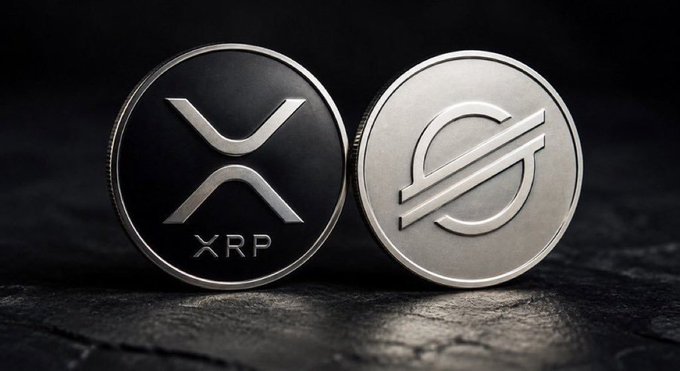 A close-up of two silver commemorative coins representing the XRP and Stellar (XLM) cryptocurrencies on a dark textured surface.