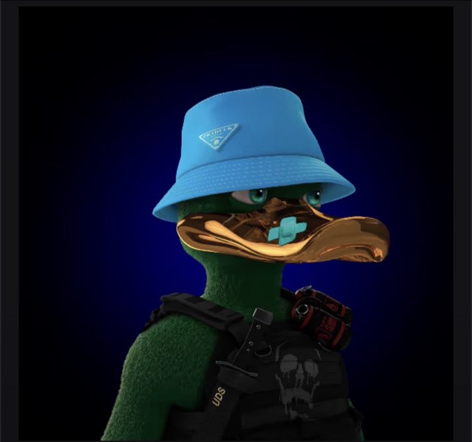 A 3D-rendered duck wearing a blue Prada bucket hat, a gold duckbill with a teal grill, and a tactical vest with "UDS" branding and a skull emblem, set against a dark blue background. The image ties to the post by showcasing another minted UGLYDUCKLABZ NFT character, reflecting the creator's enthusiasm for minting despite mixed feedback.