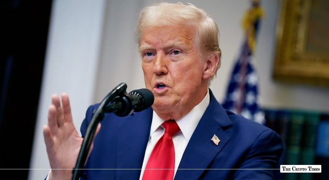President Donald Trump speaks at a podium, with "THE CRYPTO TIMES" watermark visible in the lower right corner. This image illustrates the post about Trump working on the CLARITY Act for crypto regulations.
