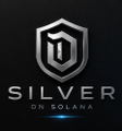 A logo featuring a silver shield with a stylized '11' inside, accompanied by the text 'SILVER ON SOLANA' below.