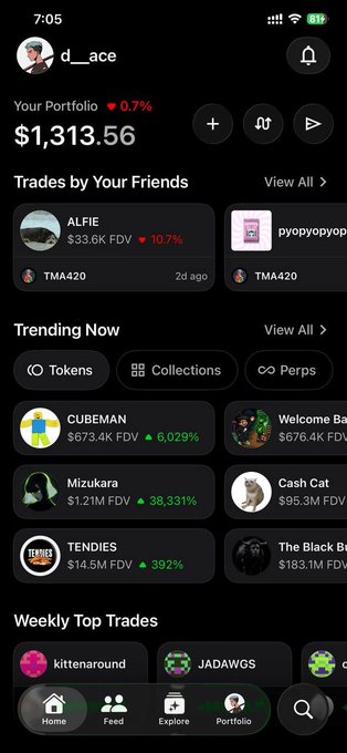 A screenshot of a crypto social trading app showing a portfolio value of '$1,313.56' (down 0.7%) for user 'd__ace', with sections for 'Trades by Your Friends' (ALFIE, pyopyopyop), 'Trending Now' (CUBEMAN, Mizukara, TENDIES, etc.), and 'Weekly Top Trades'.