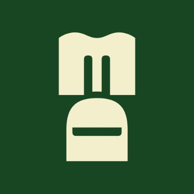 A stylized "M" logo in beige on a dark green background, representing MonkeDAO. The image complements the post's message about MonkeDAO being a community-driven Solana Monkey Business (MBS) project, with the "M" symbolizing the collective nature of the DAO.