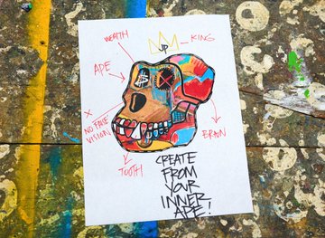 A colorful painted skull poster with labels like "WEALTH," "LIPS," "KINGS," "EARS," "TOOTH," and "AN EYE" is taped to a weathered, paint-splattered surface, with the message "CREATE FROM YOUR INNER SELF" at the bottom—capturing the creative, self-expressive vibe the post praises as "so dope."