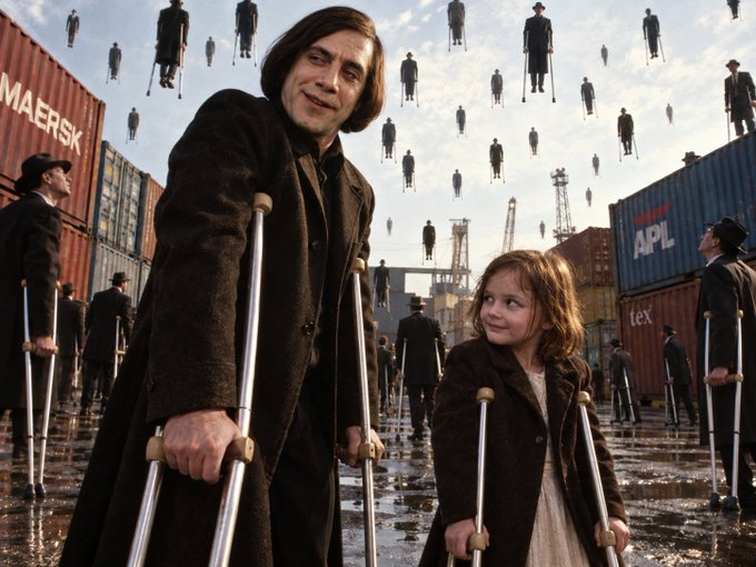 A scene featuring a smiling man with crutches standing beside a young girl also holding crutches, with numerous figures floating in the sky above a shipping container yard with 'MAERSK' and 'APL' containers visible.