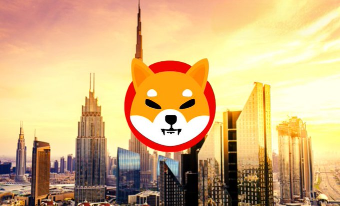 The Shiba Inu ($SHIB) logo is prominently displayed over the Dubai skyline, illustrating the cryptocurrency's new acceptance at Dubai Duty Free's airport stores, marking a notable real-world adoption milestone in the UAE.