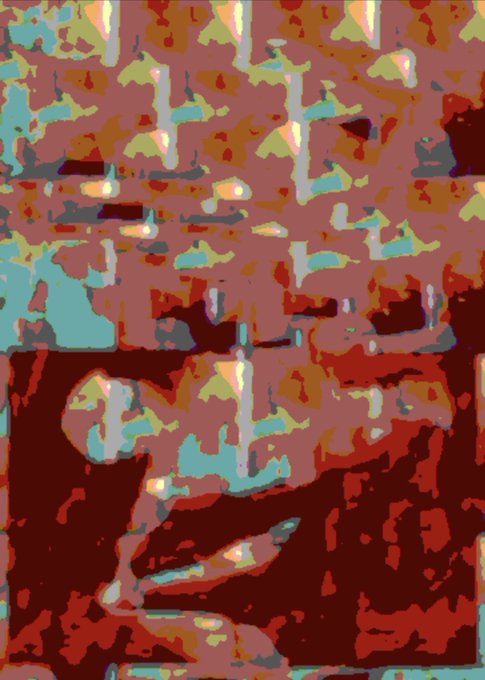 A heavily pixelated or distorted abstract image showing patches of red, brown, teal, and green colors with no recognizable subjects.