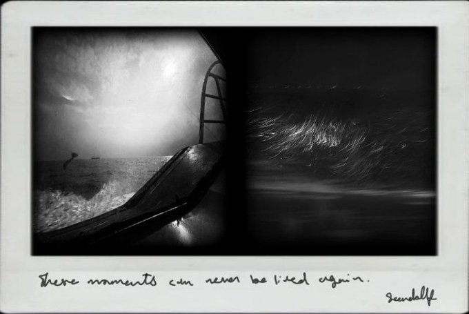 A moody, experimental polaroid photograph showing a dark seascape with light streaks and a ladder silhouette, captioned in handwritten text: "These moments can never be lived again." signed "scuddellff".