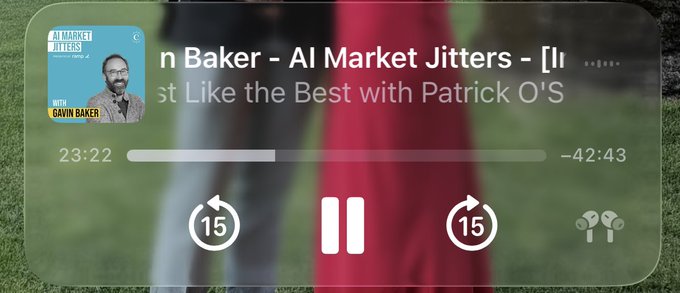 A podcast interface displays "Gavin Baker - AI Market Jitters - [Invest Like the Best with Patrick O'S]" at the 23:22 mark with -42:43 remaining, with artwork featuring Gavin Baker in glasses. The paused player relates to the post about Gavin Baker returning to spread reassurance amid AI market concerns.