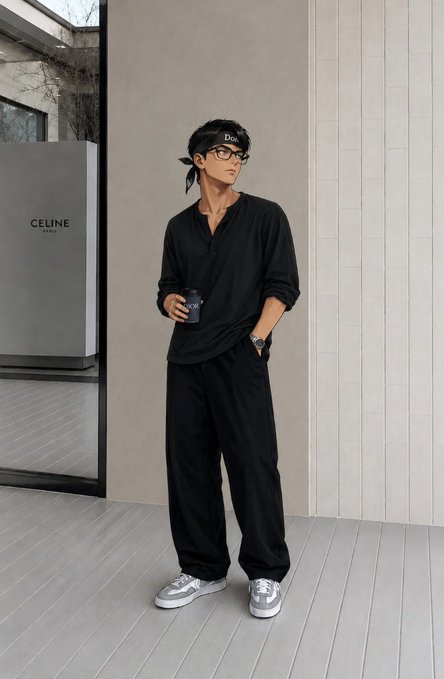 A young man stands on a wooden deck wearing an all-black casual outfit, a Dior bandana, glasses, and gray sneakers, holding a drink in a modern outdoor setting with a 'CELINE PARIS' sign visible.