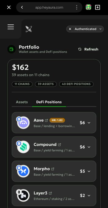 Screenshot of the HeyAura app showing a DeFi portfolio worth $162 across 39 assets on 11 chains, listing positions on Aave, Compound, Morpho, and Layer3.