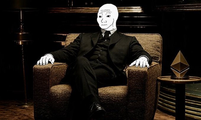 The image features a man sitting in an armchair, wearing a suit and tie. The man appears to be sad or contemplative as he looks down at his hands. In the background, there is a lamp that adds depth to the scene. A small gold statue can also be seen on a table nearby. The post accompanying this image reads: "I'M NOT surprised to see $WOJAK in the hall of fame the meme is too strong to ignore now". This statement suggests that the man's sadness or contemplation might be related to a recent event involving the famous actor, and it adds an interesting layer to the overall scene.