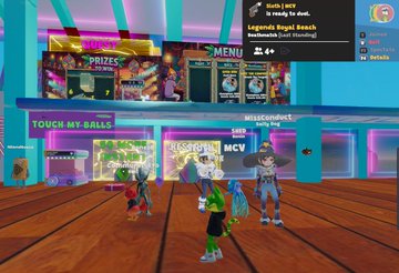 A group of avatars in a colorful virtual arcade gathers on a wooden floor near game stations labeled "TOUCH-MY-BALLZ," "GIRLY TOMBOY MCV," and "MENU," with a leaderboard showing "Legends Royal Beach" and "TouchyToad (Dual Standing) Rank 9" in the top right—reflecting the "Legends Beach Towel" social activity mentioned in the post.