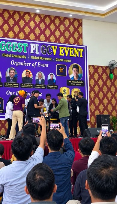 People gather at the "Biggest Pi GCCY Event" organized by Dr. Nicolas Kokkalis, CTO of Pi Network, where individuals on stage are exchanging a trophy or award while attendees capture the moment on their phones. The event, held in collaboration with various co-founders and team members, highlights Pi Network's real-world adoption beyond just mining, aligning with the post's message that Pi has launched three functional products that businesses actually pay to use.