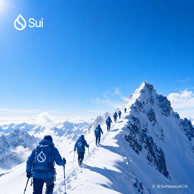 Climbers in blue jackets with the Sui logo ascend a snowy mountain ridge under a clear blue sky, with the Sui logo in the corner and the handle @SuiNetworkCN visible.