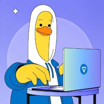 The image features a cartoon duck sitting at a table with a laptop computer open in front of him, wearing a white hoodie or cap. The background of the image has purple and blue colors, which could be interpreted as a representation of the season being "Gm fam" (graphic design family). The caption below the image reads: "Gm fam $Gram season begins today. Are you ready?".