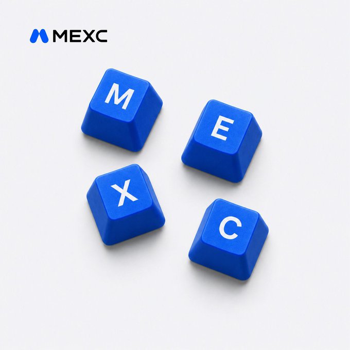 The image features a collection of four blue keys with white letters spelling out "MEXC". The keys are arranged in a square formation, each one placed next to another. The arrangement suggests that these keys might be part of a keyboard or control panel for a computer system. The text "MEXC" is prominently displayed on the keys, indicating their purpose and likely association with a specific device or software.