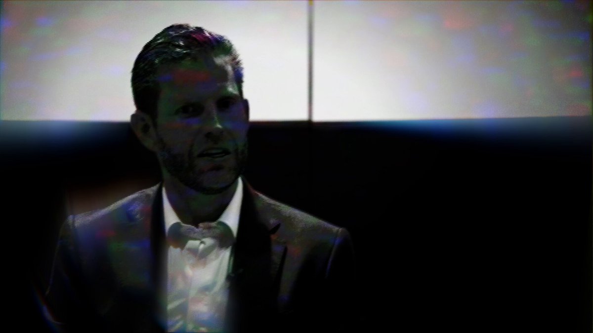 The image features a man wearing a suit and tie sitting down with another person at a table. The background of the photo shows a window, suggesting that they are indoors or in an office setting. The main subject of the image appears to be the conversation between the two individuals, which is likely related to the post about Bitcoin mining and digital finance on social media platforms.