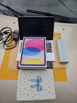 The image shows a new iPad (10th generation) and MacBook Air unboxed together with their packaging, presented as a fresh start setup. This ties to the post's theme of rebuilding after losing two YouTube channels, representing the creator's new equipment and renewed determination to restart their content creation journey despite previous setbacks.