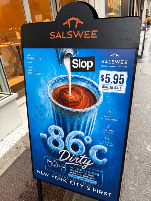 A sandwich board advertisement for Salswee's "-86°C Dirty" drink challenges customers to "drink the dirty in 1 minute" for a free drink and merch. The signage promotes "New York City's first" frozen coffee concept at $5.95, tying into the social/tech theme by gamifying consumption and encouraging social sharing of the feat.