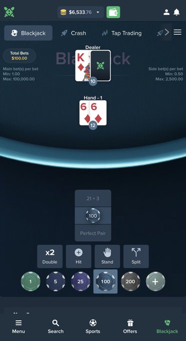 A screenshot of an online blackjack game on what appears to be a betting app, showing the dealer with a King of diamonds and a hidden card, the player's hand as two 6 of diamonds totaling 12, with a chip balance of $6,533.76 and betting chips ranging from 1 to 200 visible at the bottom.