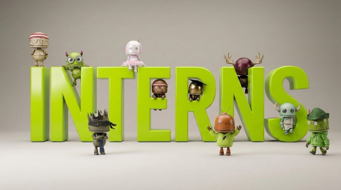 A collection of cute monster characters surrounds large green 3D letters spelling "INTERNS," visually representing the original project name mentioned in the lore. The playful cast of colorful creatures ties directly to the story of the project pivoting away from the "Interns" name after spotting a similar memecoin.