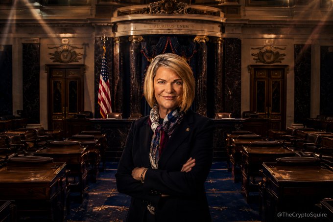 Senator Cynthia Lummis stands confidently with arms crossed in the U.S. Senate chamber, with the watermark "@TheCryptoSquire" visible in the bottom right corner. The image accompanies a message thanking her for her efforts toward crypto regulatory clarity, symbolizing the appreciation from the XRP community for her legislative advocacy.