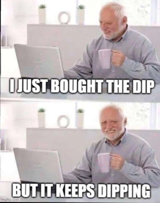 A two-panel meme showing an older man with a white beard smiling at a laptop while holding a pink mug; the top panel reads 'I JUST BOUGHT THE DIP' and the bottom reads 'BUT IT KEEPS DIPPING'.